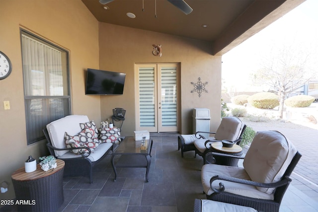 view of patio with french doors and ceiling fan