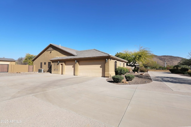 view of front of house featuring a garage and a mountain view