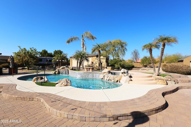 view of pool with pool water feature and a patio area