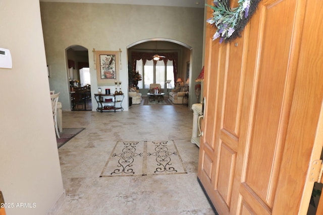 entryway featuring a high ceiling