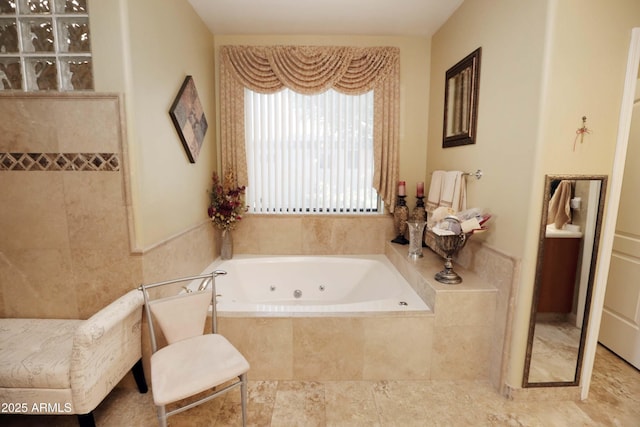 bathroom featuring tile patterned flooring and a relaxing tiled tub