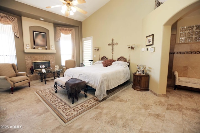 bedroom with high vaulted ceiling and ceiling fan