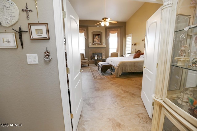 bedroom featuring a large fireplace