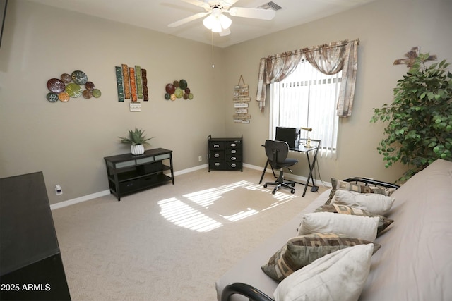 carpeted home office with ceiling fan