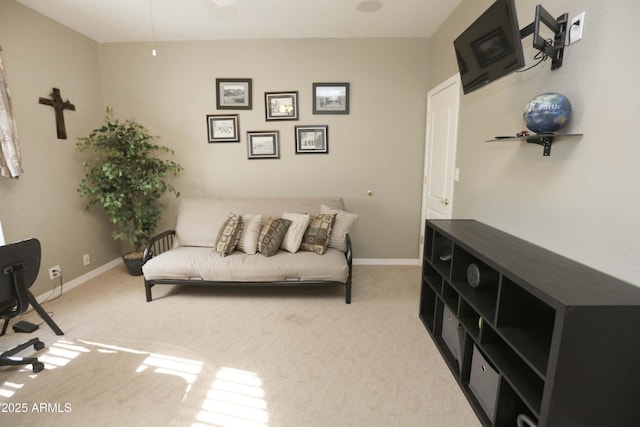 sitting room featuring light colored carpet