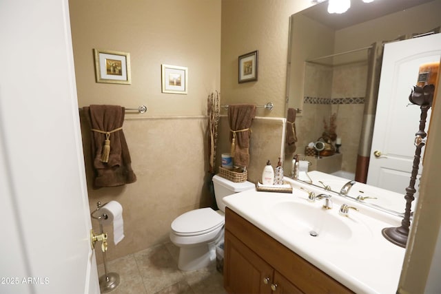 bathroom with vanity, toilet, and tile patterned flooring