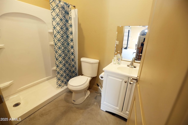 bathroom featuring vanity, toilet, and a shower with shower curtain