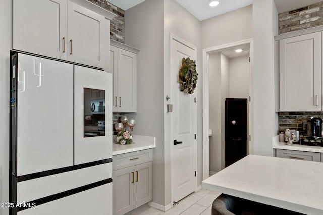 226 E Markwood Dr, Chandler, AZ 85286 - kitchen with white fridge, tasteful backsplash, and recessed lighting
