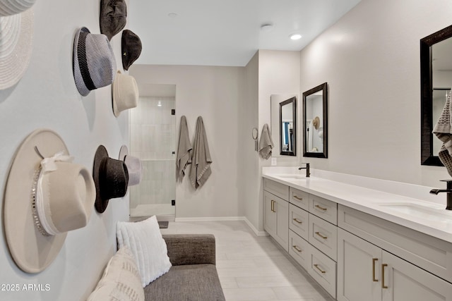 226 E Markwood Dr, Chandler, AZ 85286 - bathroom featuring double vanity, a tile shower, and baseboards