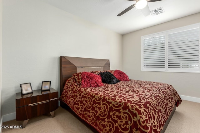 bedroom featuring light colored carpet and ceiling fan