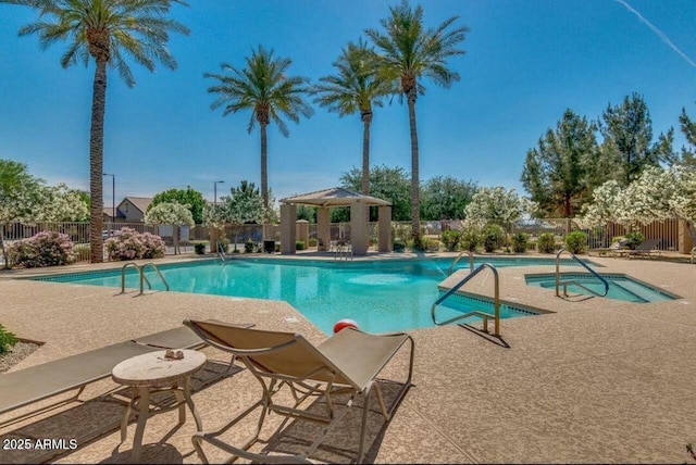 view of swimming pool featuring a gazebo and a patio