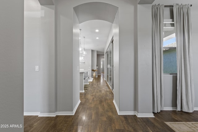 4302 E Cynthia St, Gilbert, AZ 85295 - corridor featuring dark wood finished floors, arched walkways, and recessed lighting