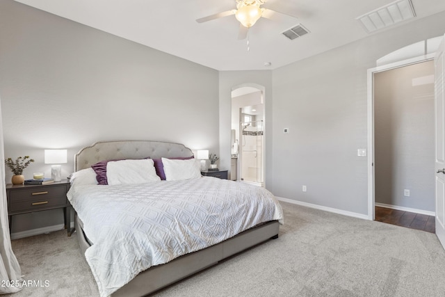 4302 E Cynthia St, Gilbert, AZ 85295 - bedroom featuring carpet floors, arched walkways, ensuite bath, and a ceiling fan