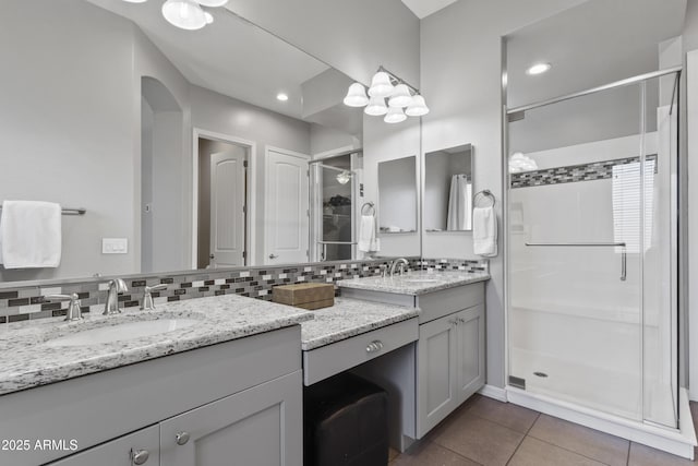 4302 E Cynthia St, Gilbert, AZ 85295 - full bath featuring a stall shower, double vanity, decorative backsplash, and tile patterned flooring