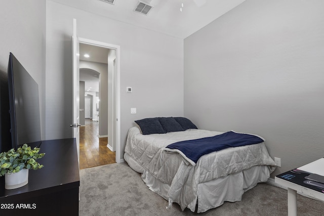 4302 E Cynthia St, Gilbert, AZ 85295 - bedroom featuring arched walkways, vaulted ceiling, and wood finished floors