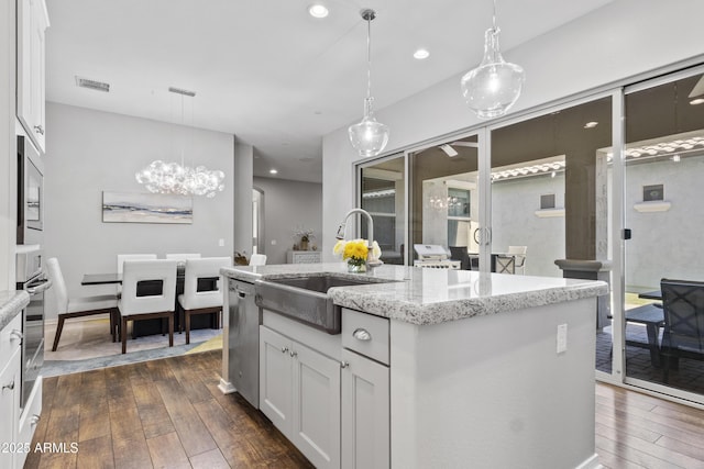 4302 E Cynthia St, Gilbert, AZ 85295 - kitchen with dark wood finished floors, stainless steel dishwasher, a chandelier, white cabinetry, and recessed lighting