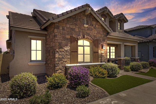 4302 E Cynthia St, Gilbert, AZ 85295 - view of front facade with stone siding, a tile roof, and stucco siding