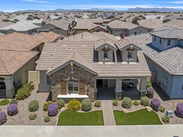 4302 E Cynthia St, Gilbert, AZ 85295 - view of front of home featuring stone siding, stucco siding, a residential view, and a porch