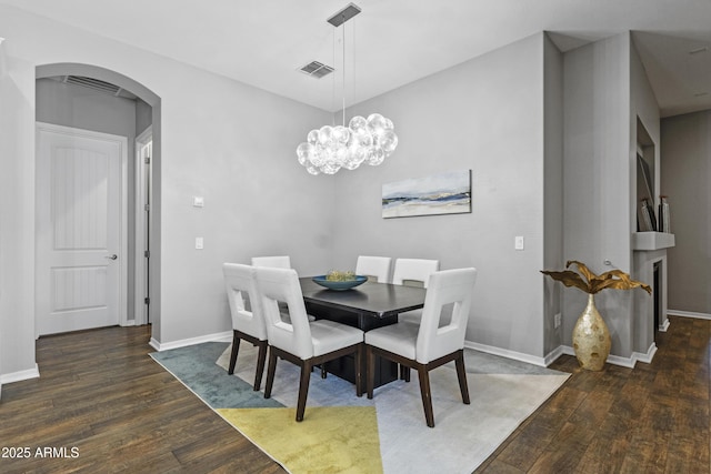 4302 E Cynthia St, Gilbert, AZ 85295 - dining area with arched walkways, hardwood / wood-style floors, and a chandelier