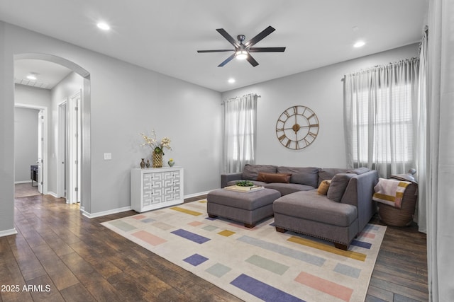 4302 E Cynthia St, Gilbert, AZ 85295 - living area with arched walkways, a ceiling fan, healthy amount of natural light, wood finished floors, and recessed lighting