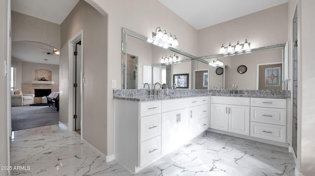 bathroom featuring ceiling fan and vanity