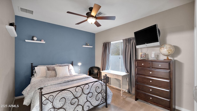 bedroom featuring light carpet and ceiling fan