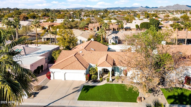 birds eye view of property with a mountain view