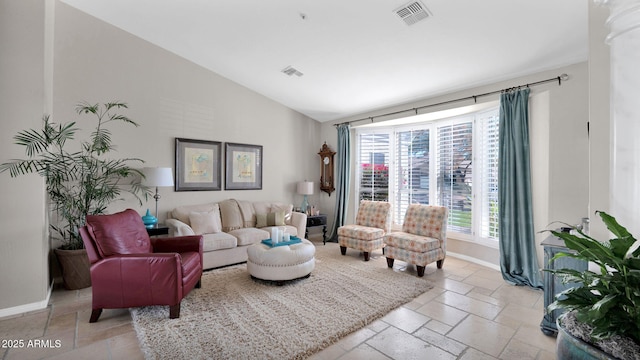 living room featuring lofted ceiling