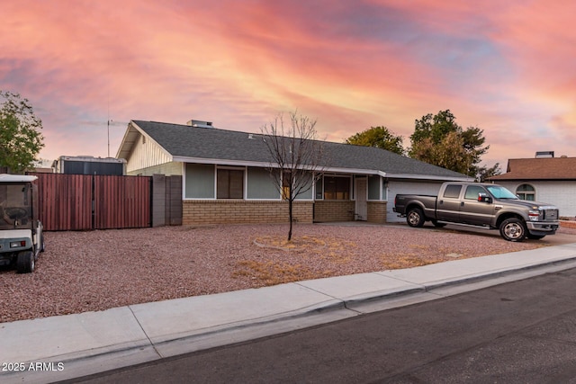 single story home with a garage