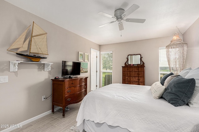 bedroom featuring ceiling fan and light wood-type flooring