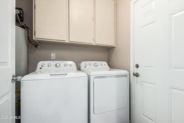 laundry room featuring cabinets and separate washer and dryer