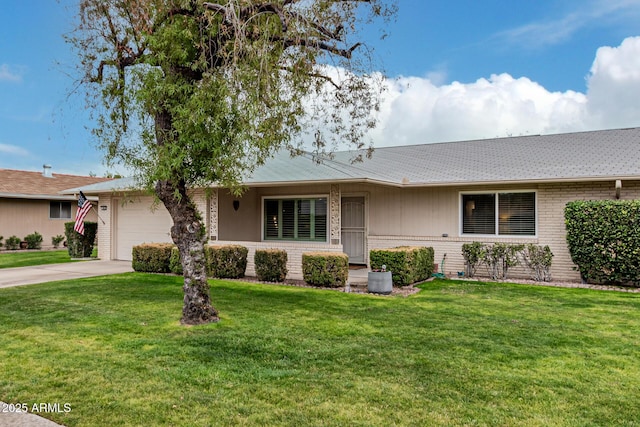 ranch-style home featuring a garage and a front yard