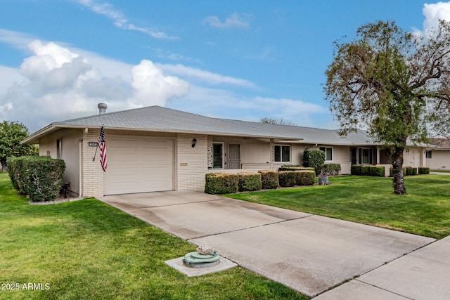 single story home with a garage and a front lawn