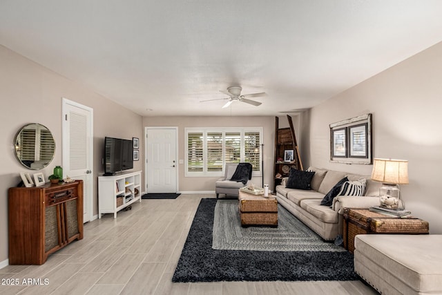 living room featuring ceiling fan and light wood-type flooring