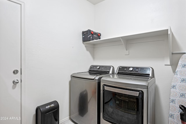 washroom with washer and dryer