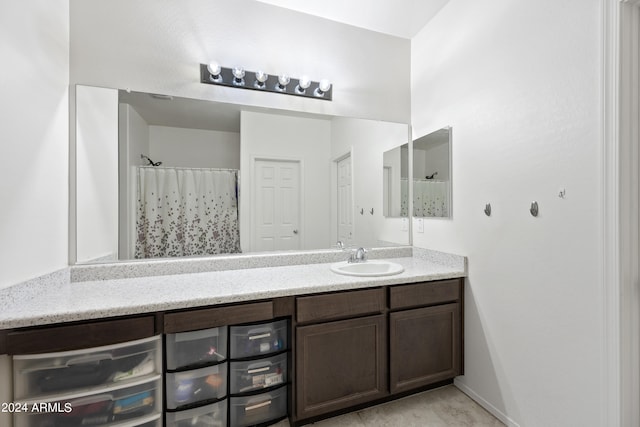 bathroom with a shower with curtain and vanity