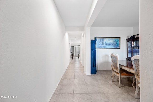 corridor with light tile patterned floors