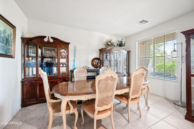 dining area featuring light tile patterned floors