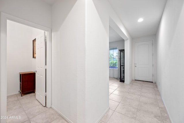 hallway with light tile patterned floors