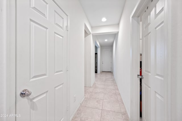 hallway with light tile patterned flooring