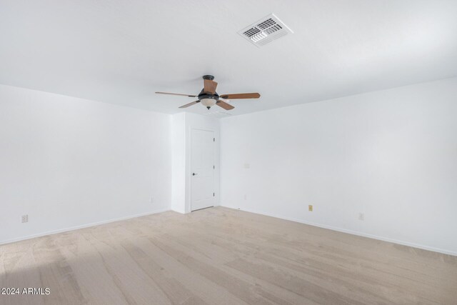 spare room featuring ceiling fan and light hardwood / wood-style floors