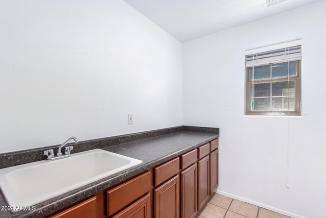 interior space featuring sink and light tile patterned floors