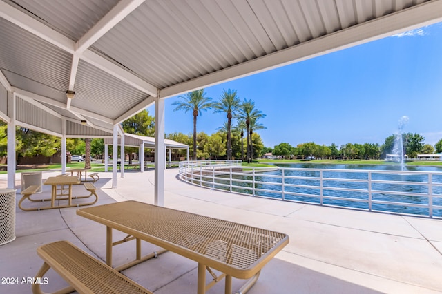 view of patio with a water view