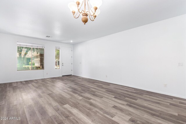 unfurnished living room featuring ceiling fan, a fireplace, and hardwood / wood-style floors