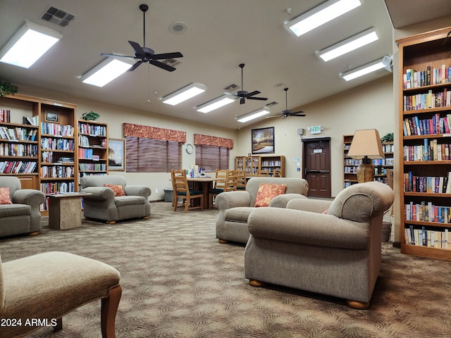 carpeted living room featuring high vaulted ceiling and ceiling fan