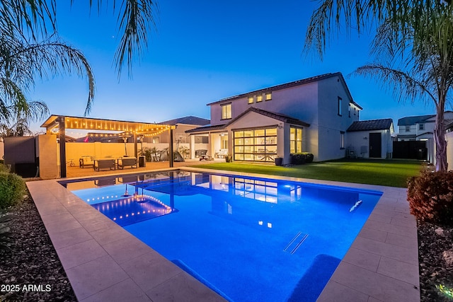 view of swimming pool featuring a fenced in pool, a yard, outdoor lounge area, and fence