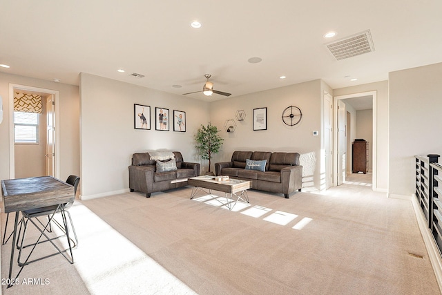 living area featuring light carpet, recessed lighting, visible vents, and ceiling fan