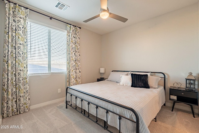 bedroom with ceiling fan, baseboards, visible vents, and carpet floors