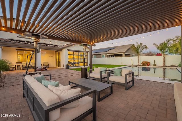 view of patio / terrace featuring a fenced backyard, outdoor lounge area, outdoor dining area, and a pergola