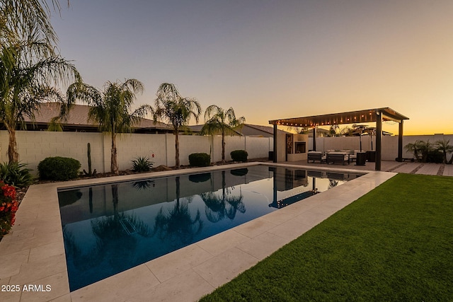 view of swimming pool featuring a fenced in pool, a patio area, a fenced backyard, an outdoor hangout area, and a lawn